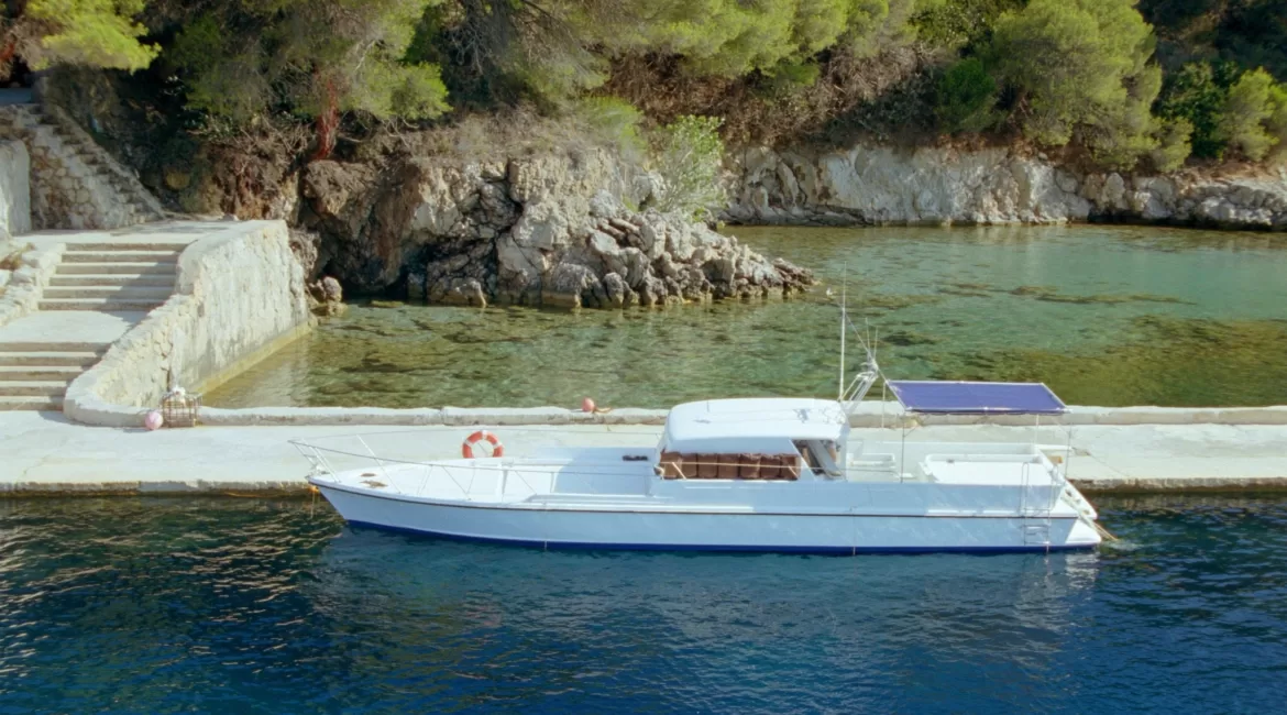 A private boat rental in Taormina at anchor in a quiet cove on the Sicilian coast