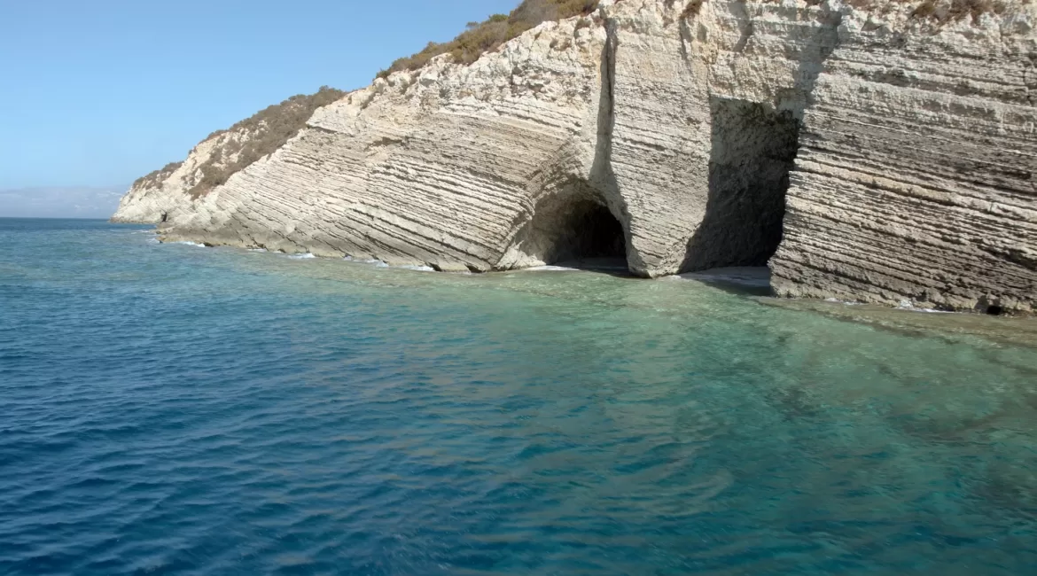 The Baia delle Sirene near Taormina, with limestone overhangs and clear turquoise water